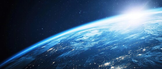 Fototapeta premium Earth from space showing sunrise over the horizon with glowing city lights, showcasing planet beauty and vast universe in stunning cosmic imagery.