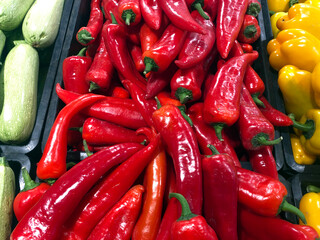 Bright red hot peppers. Ripe vegetables. Autumn harvest.