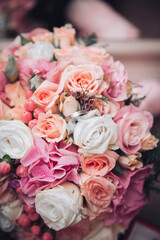 A simple silver engagement ring nestled inside a vibrant flower bouquet. A symbolic image of love, romance, and marriage, perfect for wedding and anniversary themes.