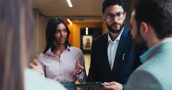 Tablet, teamwork and meeting with business people in office for research, networking and seminar schedule. Convention center, keynote speaker and collaboration with employees in hotel lobby for idea