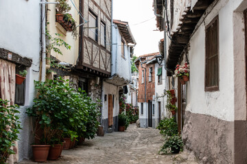 Obraz premium Beautiful view of a typical and narrow street in the Jewish Quarter of Hervás, one of the best preserved in Spain, an Ambroz Valley village at Caceres, Extremadura, Spain. 