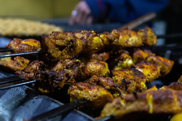 Grilled chicken skewers with spices and flavors.