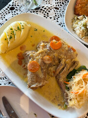 Rabbit stew with potato on the side.