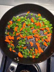 Carrot and capsicum in the frying pan.