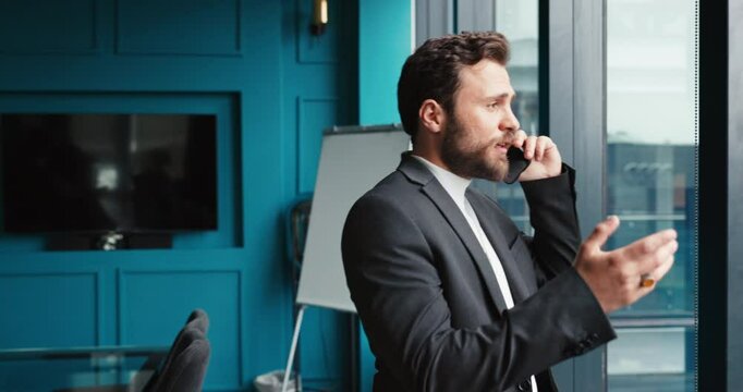 Happy, businessman and window with phone call for communication, business proposal or negotiation at office. Man, financial advisor or accountant talking with mobile smartphone for finance advice