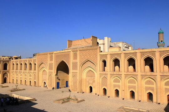 Baghdad, Bagdad, Iraq - November 15 2024: people visit the Al-Mustansiriya School Madrasah in Baghdad