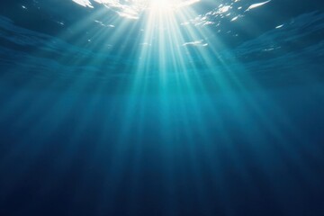 Fototapeta premium Dark blue ocean surface with sunlight filtering down through the water, waves, water