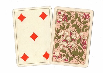 A pair of antique playing cards with one card revealed.