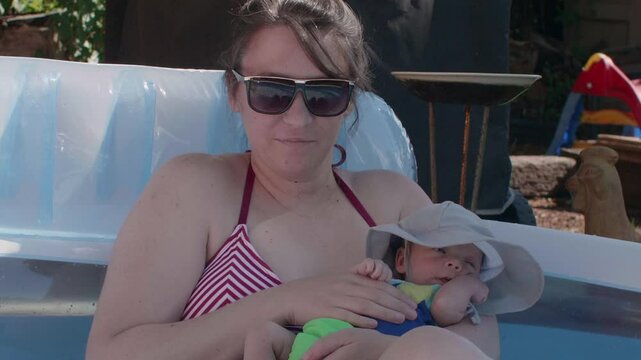Mother Enjoying the Pool with Baby