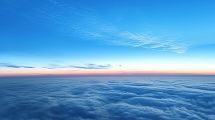 Fototapeta premium Dusk Aerial Sky View: Serene Blue and Orange Gradient Clouds over a Clear Horizon from Airplane.