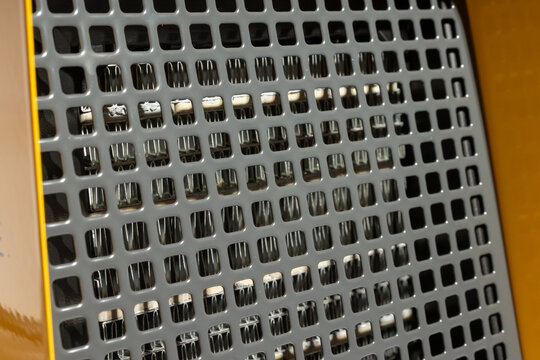 Angle view of the Ballu machine's side showing the grill pattern.