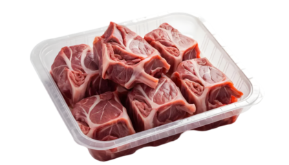 Fresh uncooked cut ox tail in a plastic tray wrapped in plastic on transparent background
