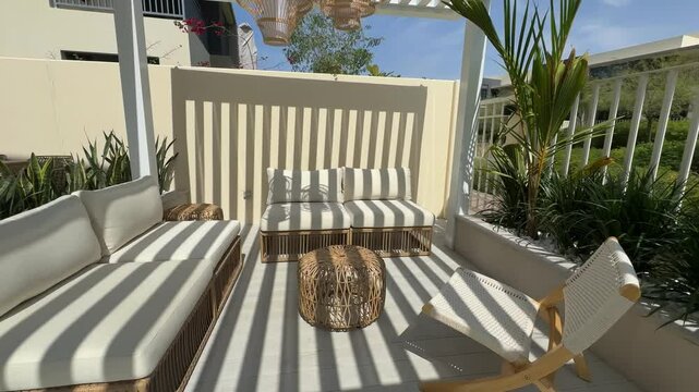 Sofa under a canopy in the backyard of a luxury villa in Dubai on a sunny day