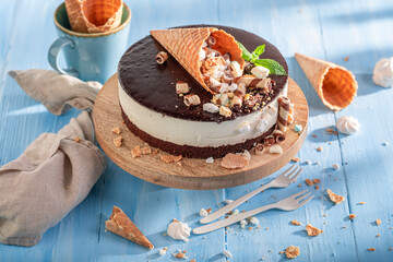 Sweet cookie cake with chocolate glaze and cream.