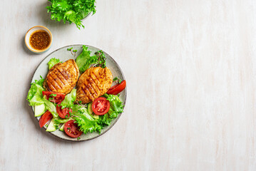 Grilled chicken fillet and vegetable salad