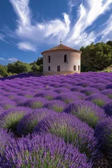 Gordijnen Lavender fields bloom beside a historic stone building under a vivid sky during mid-day in Provence, showcasing nature's beauty and architectural heritage © marimalina