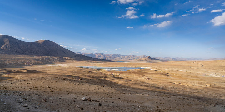 Scenic sunset mountain landscape view of high-altitude Tuzkul salt lake along Pamir Highway between Bulunkul and Alichur, Gorno-Badakhshan, Tajikistan - Powered by Adobe