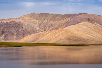 Colorful landscape view of beautiful mountain around high altitude Bulunkul lake near Pamir Highway, Murghab, Gorno-Badakhshan, Tajikistan