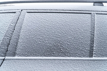 Car window glass under the frozen ice, cold winter problems concept. Frozen car. Car covered with...