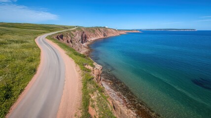 Coastal Road Winding Along Rocky Shoreline on a Sunny Day