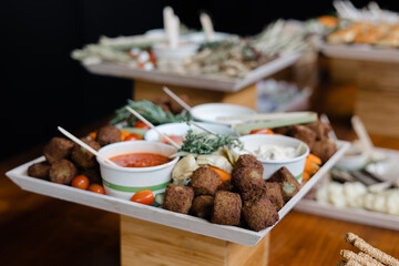 Delightful vegetarian platter featuring falafel, dips, and fresh vegetables at a catering event in...