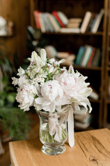 Wedding bouquet in a light delicate style in a vase with water