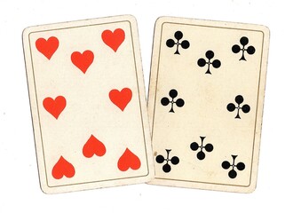 A pair of antique playing cards of the same value on a white background.