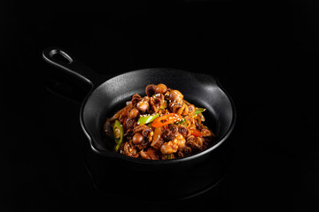Delicious stir fried dish with vegetables and mushrooms in black skillet, showcasing vibrant colors and textures. Perfect for food lovers and culinary enthusiasts