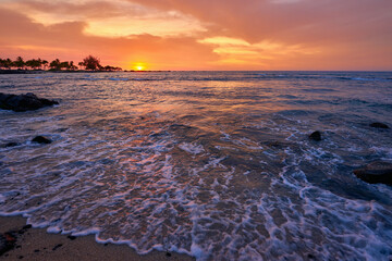 Beautiful Hawaii Sunset with Vibrant Orange Sky, Calm Ocean Waves, and Silhouette Coastline: Serene Tropical Island Nature Landscape Scenery