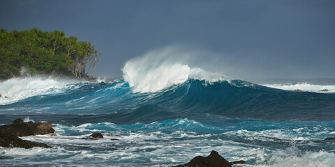 Powerful Hawaii Ocean Wave Crashing on Rocky Shore: Dramatic Seascape of Turbulent Sea and Wild Nature Energy