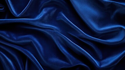 Obraz premium Velvet Embrace: A luxurious piece of deep blue velvet, its soft, shimmering texture captured in exquisite detail. The play of light and shadow accentuates the gentle folds.