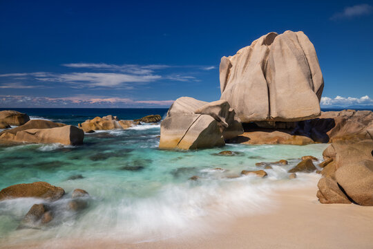 Anse Marron tropical beach with granite rocks and turquoise sea on La Digue island in Seychelles, East Africa