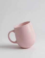 Obraz premium A Tilted Pink Ceramic Mug on a White Background: Minimalist Product Photography
