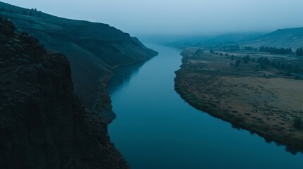Misty River Winding Through a Mountain Valley: A Serene Landscape