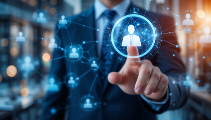 Fototapeta premium Businessman in Dark Suit Touches Glowing Blue Network of People Icons