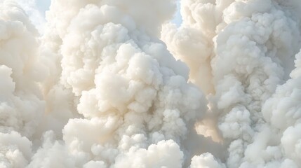 Dense Clouds of White Smoke Billowing Against a Bright Sky