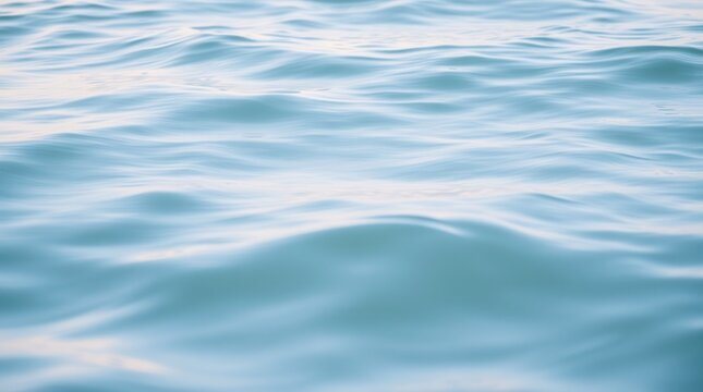 Gentle ocean waves create a calming blue texture, inviting a sense of peace and tranquility.