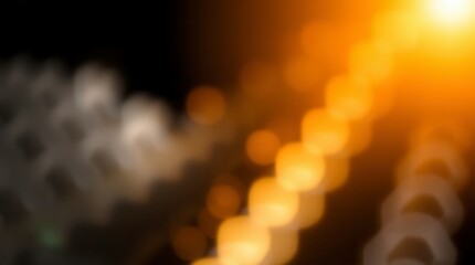 Fototapeta premium Warm golden bokeh lights dance in the darkness, creating an ethereal and captivating abstract background.