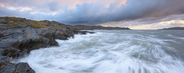Obraz premium Rugged coastline under stormy skies, waves lashing against rocky outcrops, creating intricate foam patterns and dramatic splashes of white.