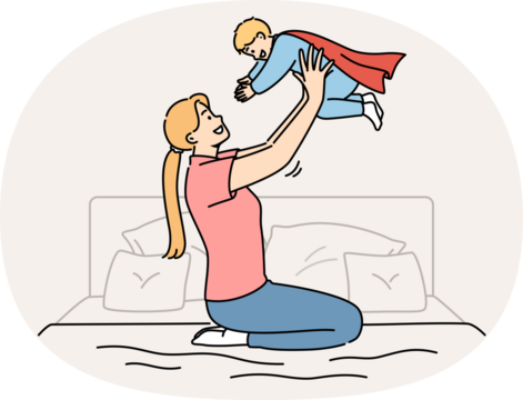 Happy mother lifts up newborn son in superhero costume, sitting on bed in bedroom. Caring casual mother plays with child, motivating son to achieve ambitious goals and success in life