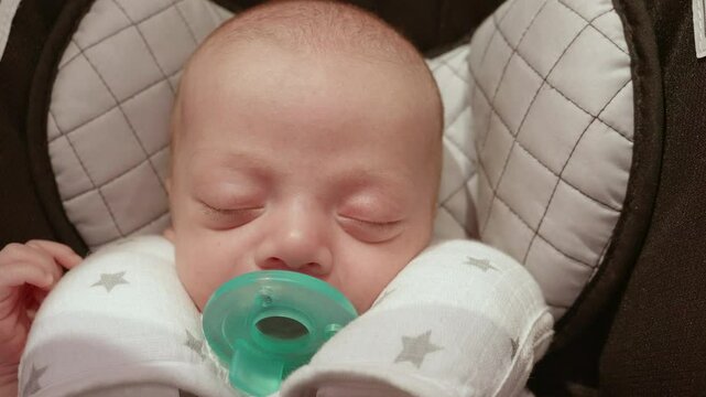 Infant Baby Boy Sleeping in Carseat closeup