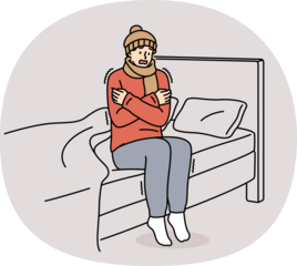 Freezing man is shaking sitting on bed and feeling chills and cold, dressed in hat and scarf. Freezing guy suffers due to lack of central heating system and poor immunity, located in bedroom