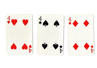 Playing cards showing three of the same value on a white background.