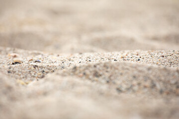 Close up of sand on the beach, shallow depth of field.