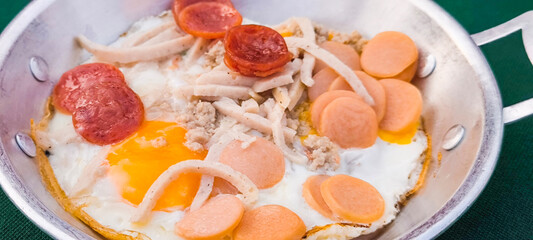 pan-fried egg with pork and toppings. Breakfast food in Thai style