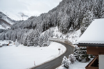 Empty road curving and going to mountain peaks