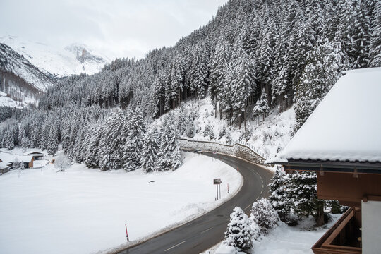 Empty road curving and going to mountain peaks