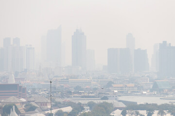 Cityscape of buildings with bad weather and smoke in Bangkok ,Thailand. Smog city from PM 2.5 dust. Air pollution concept for background.