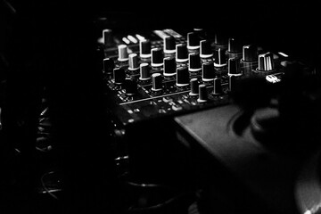 DJ set permanently installed in a dark clubZoomed in photo of DJ set.