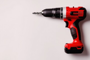 Cordless power drill with a black and silver design, featuring a red handle and a drill bit, ideal for home improvement and DIY projects, tool concept